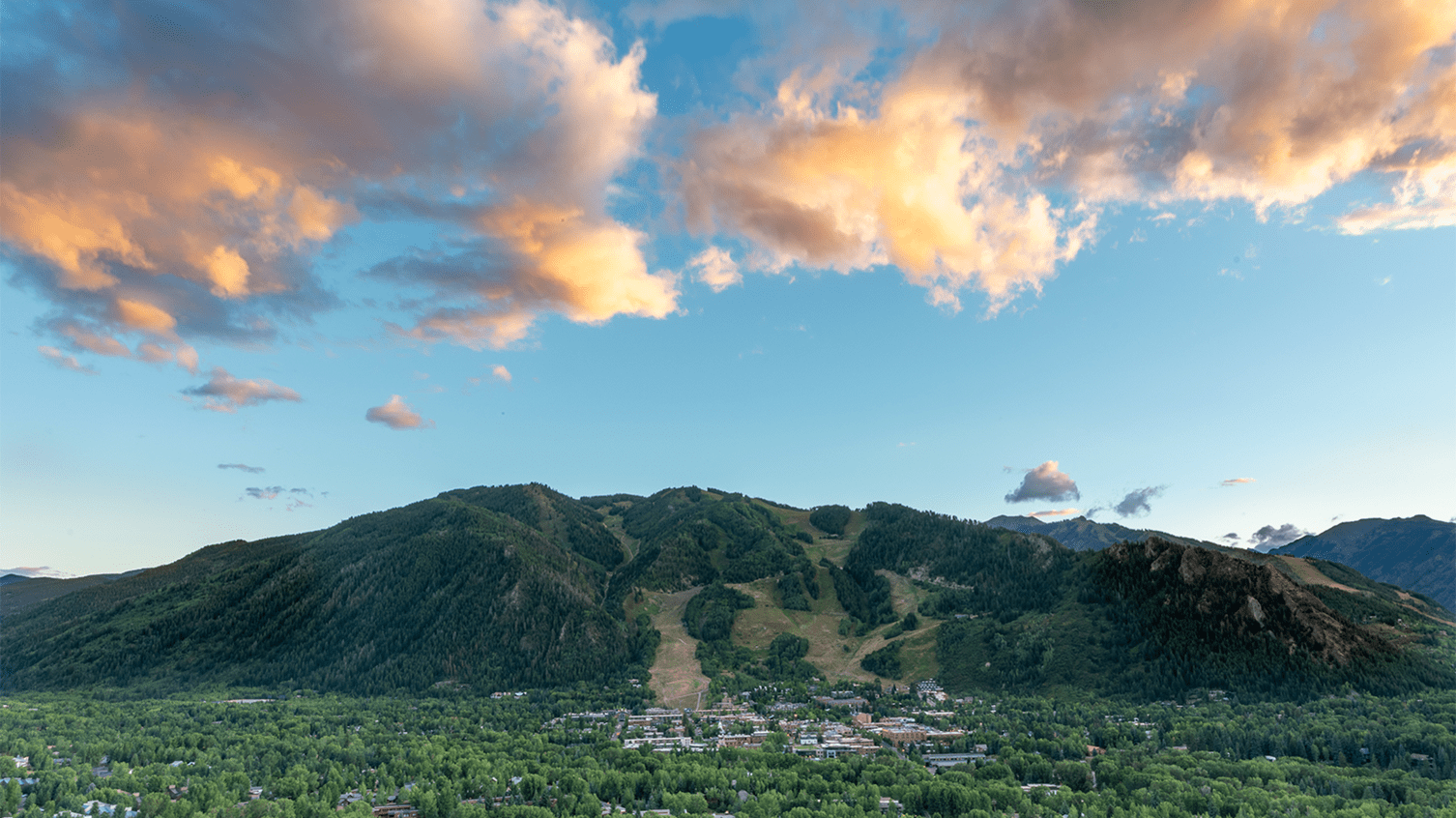 Long shot of Aspen Mountain and town of Aspen at Sunset
