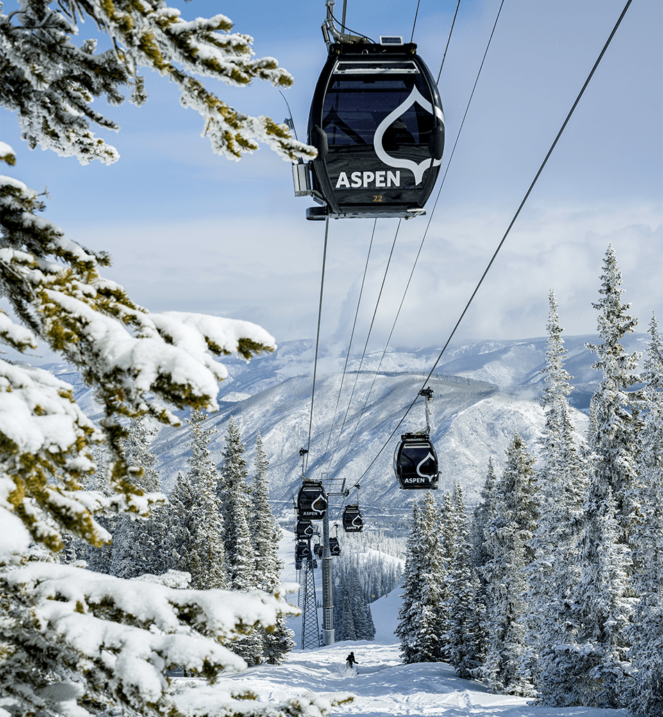Gondola moves up Aspen Mountain on a snow day at aspen mountain